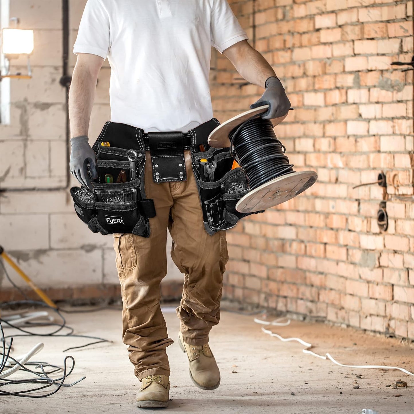 Carpenter wearing FUERI 16-pocket black leather tool belt on construction site