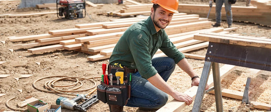 Framer wearing a FUERI leather tool belt with multiple tool pouches and hand tools at a construction site.